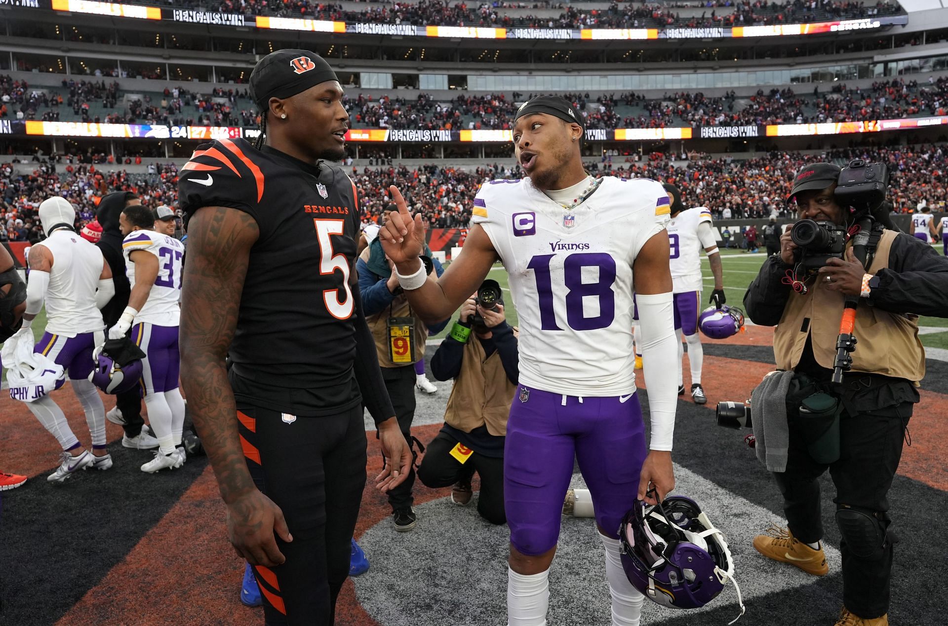 Tee Higgins left, speaks to Justin Jefferson after Minnesota Vikings v Cincinnati Bengals